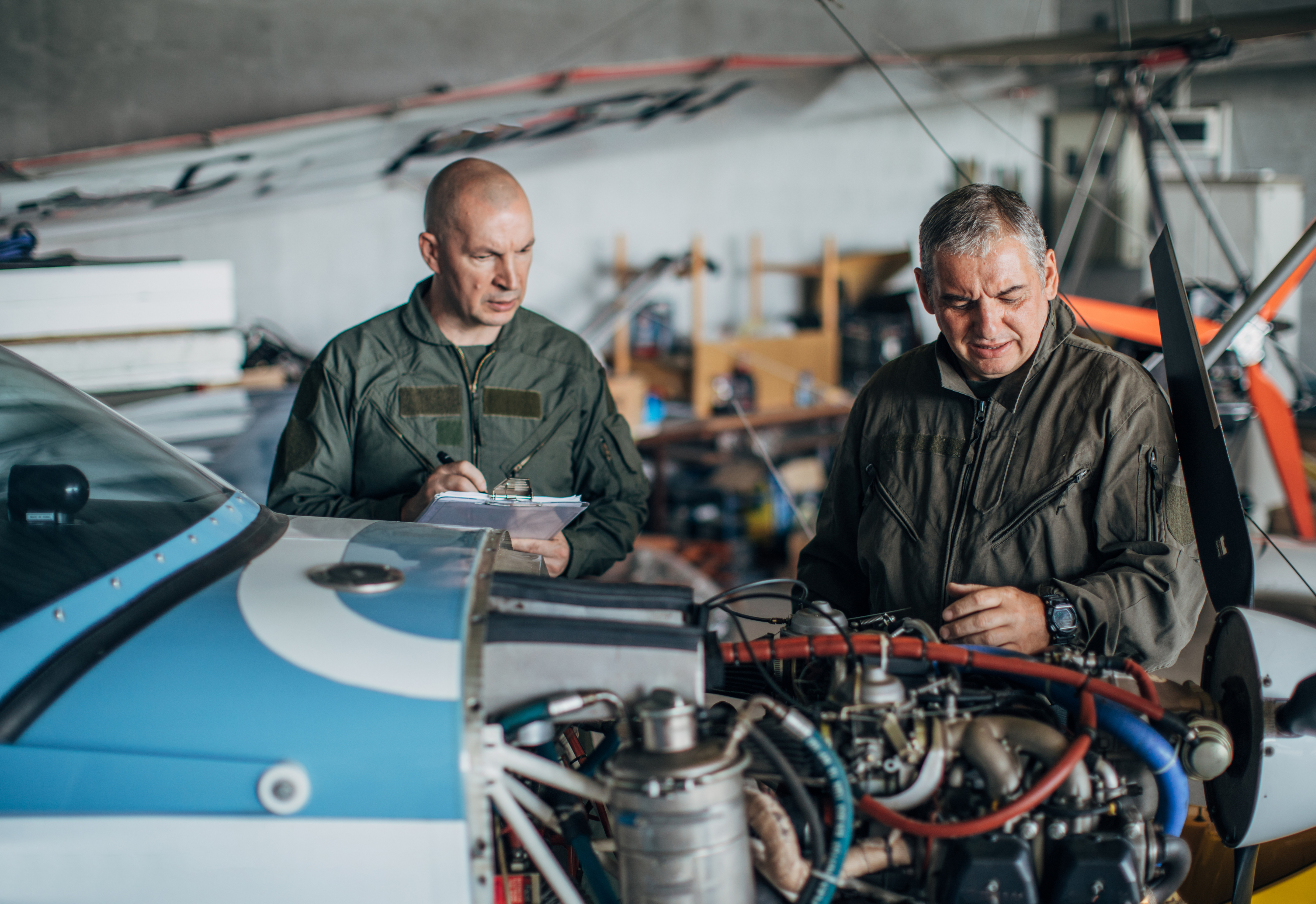 Two aviation mechanics carrying out maintenance work whilst contracting in Poland with M&E Global.